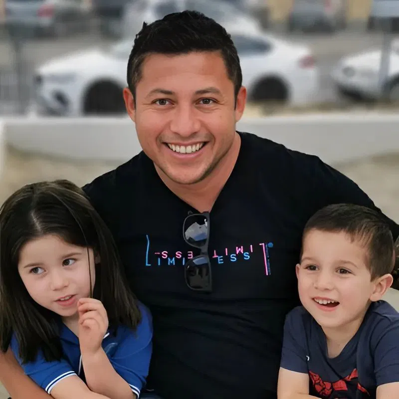 Alex, founder of Bay Smart Solutions, with his two kids in Tauranga